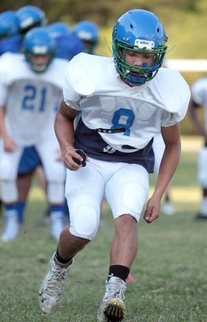 Aapri Washington, shown here in preseason practice drills, set a Gaston County rushing record with 402 yards in Friday's 48-14 Mountain Island Charter victory over Hickory Grove Christian.