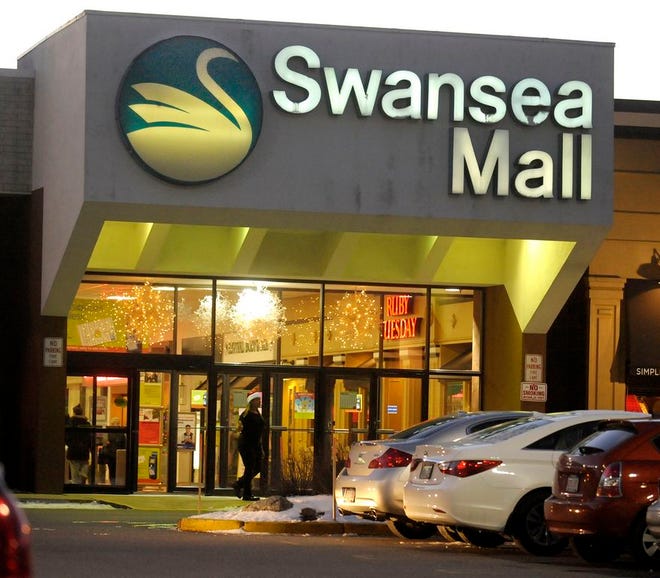 The lights of the Swansea Mall are seen at dusk in this file photo.