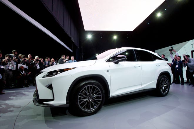FILE - In this April 1, 2015 file photo, the 2016 Lexus RX is introduced at the New York International Auto Show, in New York. Lexus and Toyota, which rely on older transmissions in many of their models, were the best-performing brands in the Consumer Reportsí annual reliability survey. (AP Photo/Mark Lennihan, File)