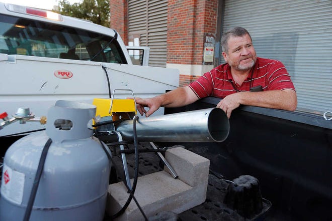 Field Operations Supervisor for the Central District of Parks Operations Michael Keller explains that they use a propane cannon 2-3 times a week, 30 minutes before sunset to 30 minutes after, to scare off Grackles in downtown Fort Worth, Wednesday, Oct. 14, 2015. (Brandon Wade/Fort Worth Star-Telegram via AP) MAGS OUT (FORT WORTH WEEKLY, 360 WEST); INTERNET OUT