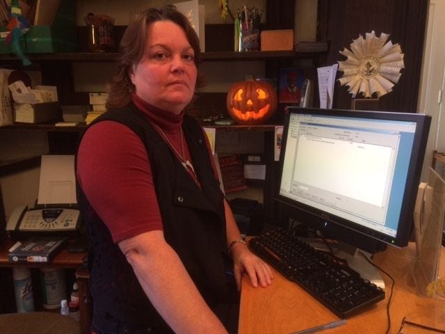 Marti Haines, librarian and ghost hunter, works at the front desk of the Library Company of Burlington on West Union Street in Burlington City.