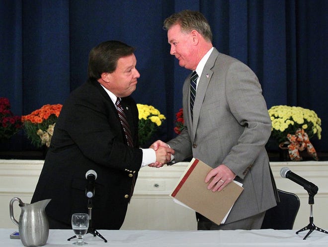 Mayor Thomas Koch and former Mayor William Phelan shake hands after the debate.