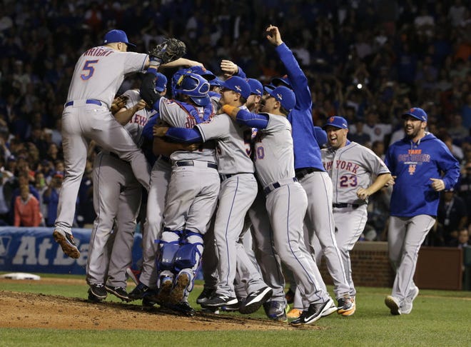 The New York Mets celebrate after earning a spot in the World Series with a sweep of the Chicago Cubs in the NLCS.