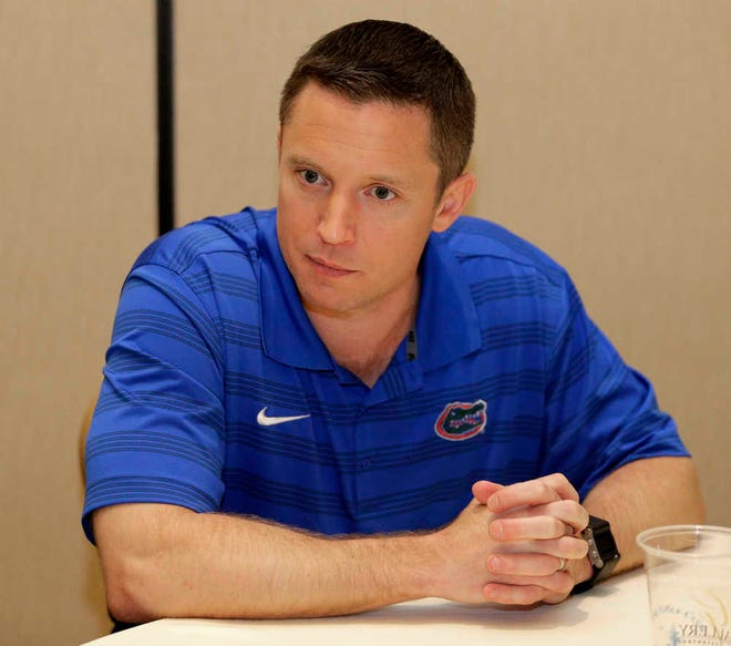 Florida head coach Mike White answers a question during the Southeastern Conference men's NCAA college basketball media day in Charlotte, N.C., Wednesday, Oct. 21, 2015. (AP Photo/Chuck Burton)