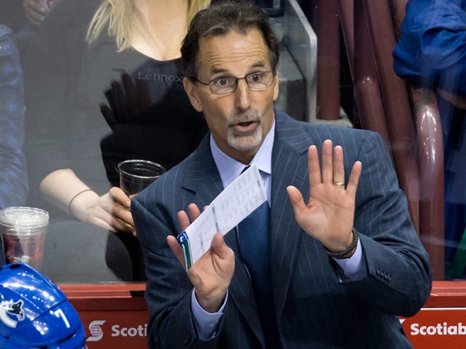 In this March 19, 2014, file photo, then-Vancouver Canucks head coach John Tortorella gestures on the bench during third period of an NHL hockey action against the Nashville Predators in Vancouver, British Columbia. After an 0-7 start, the Blue jackets have fired coach Todd Richards and replaced him with John Tortorella, Wednesday, Oct. 21, 2015.