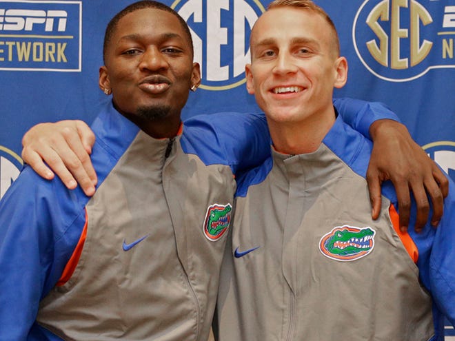 Florida's Dorian Finney-Smith, left, and Alex Murphy, right, pose for a photo during the Southeastern Conference men's college basketball media day in Charlotte, N.C., Wednesday, Oct. 21, 2015.