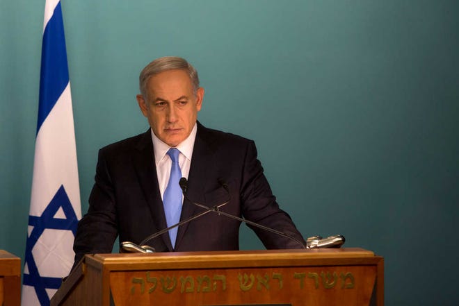 Israeli Prime Minister Benjamin Netanyahu gives a press conference with United Nations Secretary-General Ban Ki-moon at the Prime Minister's office in Jerusalem, Tuesday, Oct. 20, 2015. Netanyahu said Palestinian President Mahmoud Abbas is "fanning the flames" of recent violence. Ban is in the region calling for calm in an attempt to curb weeks of violence that has killed 10 Israelis, 43 Palestinians and an Eritrean migrant worker.(AP Photo/Sebastian Scheiner)