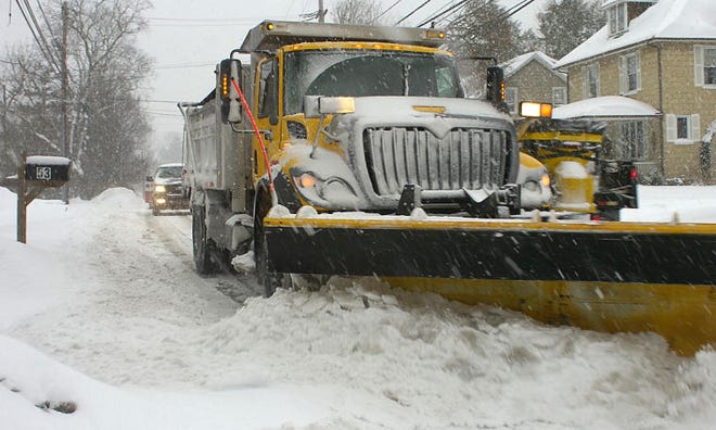A snowplow makes its way down Butler Avenue in New Britain last winter.