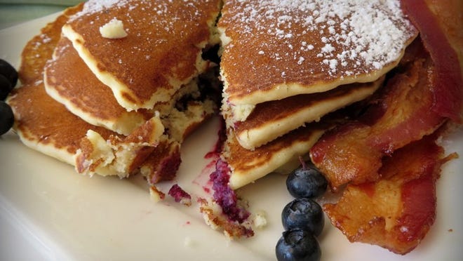 Slice into a stack of blueberry pancakes at Surfside Diner in Palm Beach. (Photo by Liz Balmaseda)