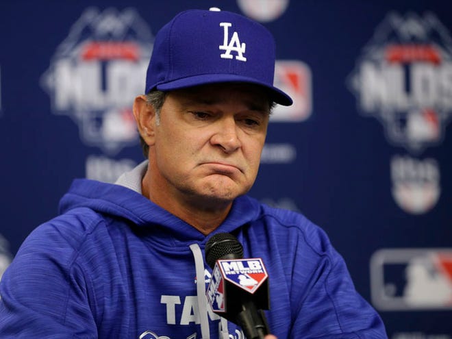 In this Monday, Oct. 12, 2015, file photo, Los Angeles Dodgers manager Don Mattingly speaks during a news conference before Game 3 of baseball's National League Division Series against the New York Mets in New York. A person familiar with the decision tells The Associated Press that Don Mattingly is out as manager of the Dodgers. The person spoke on the condition of anonymity Thursday, Oct. 22, 2015, because the team has not announced his departure. (AP Photo/Frank Franklin II, File)