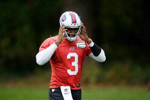Buffalo Bills quarterback EJ Manuel removes his helmet as he walks off the field at the end of an NFL training session at the Grove Hotel in Chandler's Cross, England, Thursday, Oct. 22, 2015. The Buffalo Bills play the Jacksonville Jaguars at Wembley stadium in London on Sunday in a regular season NFL game. (AP Photo/Matt Dunham)