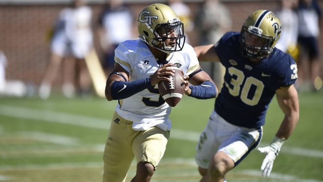 Georgia Tech quarterback Justin Thomas (5) and the rest of the Yellow Jackets’ offense has not been able to duplicate the prolific numbers it put up last season. (AP Photo/Mike Stewart)