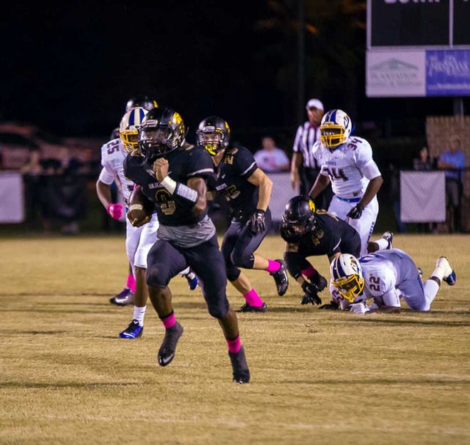 Corey Brooks for Bryan County Now Richmond Hill's Aaron Bedgood on his way to a 96-yard touchdown return Friday night.
