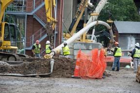 Duke Energy workers install a natural gas pipeline 115 feet under the Ohio River in June.