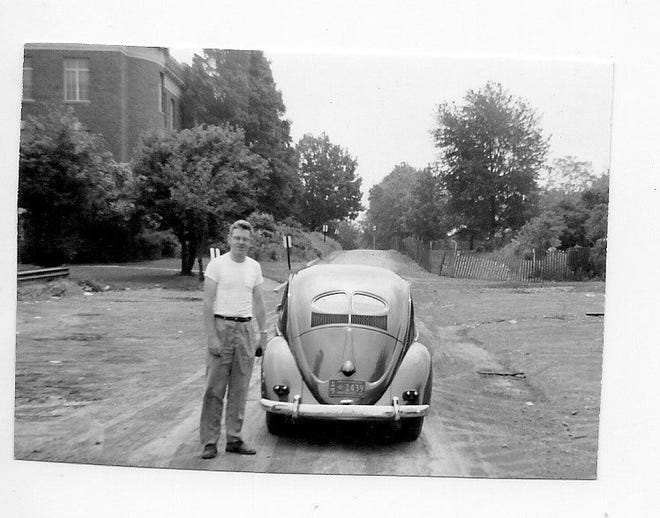 To better see the rear taillights on his first Beetle, Milford Brown made an upgrade of sheet metal with an oval of acrylic plastic in which he cemented two red truck marker lenses, one for the taillight and the other for the brake light. These can be seen with Milford standing next to it. Note that this late-1953 Beetle was the last model to have a two-piece rear window. (All photos from the Milford Brown collection)