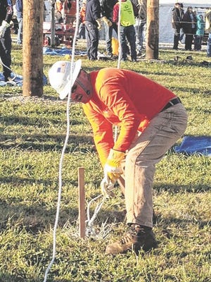 Shelby native Neal Walker teamed with David Phillips, of Huntersville, and Mike Haynes, of Marion, to place third in the senior-journeyman division of the International Lineman's Rodeo in Bonner Springs, Kan.