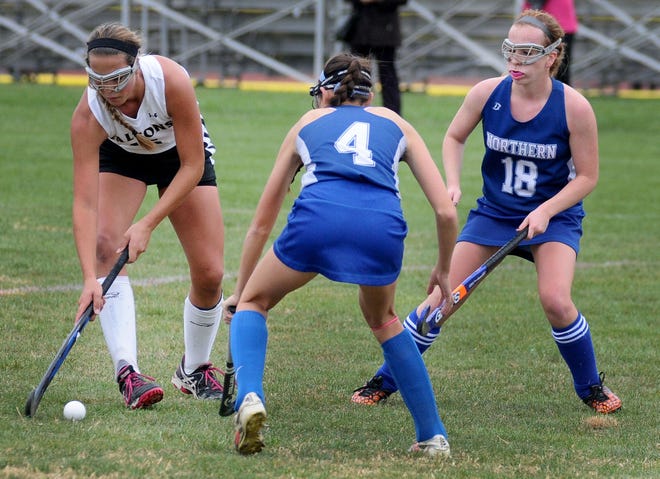 Burlington Township's Gracyn Banks (15) dribbles past Northern Burlington's Megan Walsh (4) and Erin Smith (18) during a game Tuesday, Oct. 27, 2015 at Burlington Township High School.