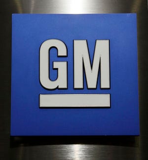 This Jan. 25, 2010, file photo, shows a General Motors Co. logo during a news conference in Detroit. General Motors Co. For the third time in eight years, General Motors is recalling cars that can leak oil and catch fire, sometimes damaging garages and houses. The recall, which covers 1.4 million vehicles dating to the 1997 model year, is needed because repairs from the first two didn't work. More than 1,300 cars caught fire after they were fixed by dealers, the company said. (AP Photo/Paul Sancya, File)
