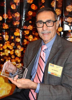 Vic DiGenti holds his first place Royal Palm Literary Award for "The Strange Case of Lord Byron's Lover." The book won in the General Catch-All Fiction category.
