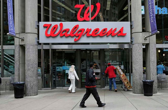 FILE - This June 4, 2014, file photo shows a Walgreens retail store in Boston. Walgreens confirmed Tuesday, Oct. 27, 2015, that it will buy rival Rite Aid, creating a drugstore giant with nearly 18,000 stores around the world. (AP Photo/Charles Krupa, File)