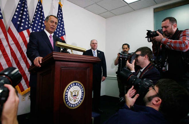 Outgoing House Speaker John Boehner of Ohio, accompanied by House Majority Whip Steve Scalise of La., right, talks with reporters on Capitol Hill in Washington, Tuesday, Oct. 27, 2015. House Republican leaders on Tuesday pushed toward a vote on a two-year budget deal despite conservative opposition, relying on the backing of Democrats for the far-reaching pact struck with President Barack Obama. In his last days as speaker, John Boehner was intent on getting the measure through Congress and head off a market-rattling debt crisis next week and a debilitating government shutdown in December. The deal also would take budget showdowns off the table until after the 2016 presidential and congressional elections, a potential boon to the eventual GOP nominee and incumbents facing tough re-election fights. (AP Photo/Lauren Victoria Burke)