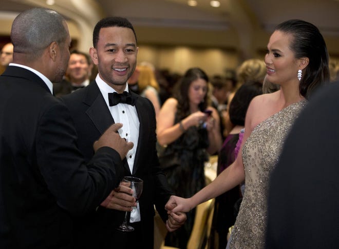 Singer John Legend and his wife, model Chrissy Teigen, attend the White House Correspondents' Association Dinner in 2013 in Washington, D.C. The Associated Press
