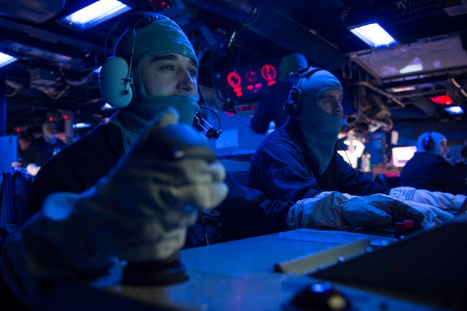 Fire Controlmen 2nd Class Jonathon Odom, from Mobile, Alabama, and John Hardesty, from Tampa, Florida, monitor the optical sight system and Mk-45 5-inch gun fire control system during a general quarters drill aboard the Arleigh Burke-class guided-missile destroyer USS Farragut (DDG 99) Oct. 16, 2015. Farragut, homeported in Mayport, Florida, is conducting naval operations in the U.S. 6th Fleet area of operations in support of U.S. national security interests in Europe.