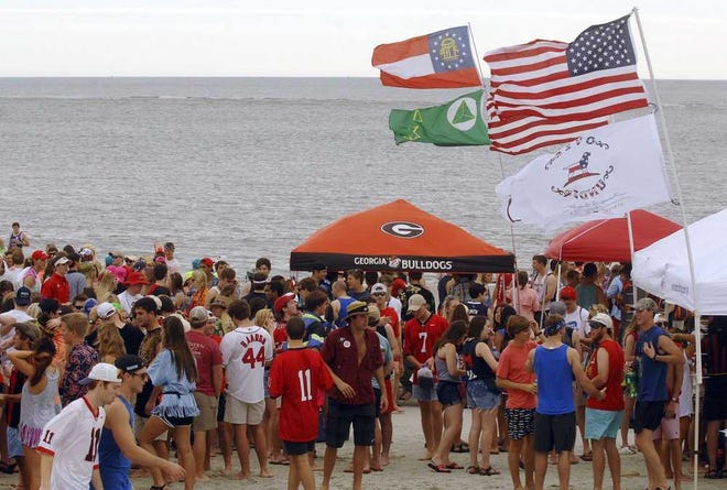 The flags were flying on the St. Simons Island beach as thousands of Georgia students and fans gathered in 2013 for what has become an annual beach party.