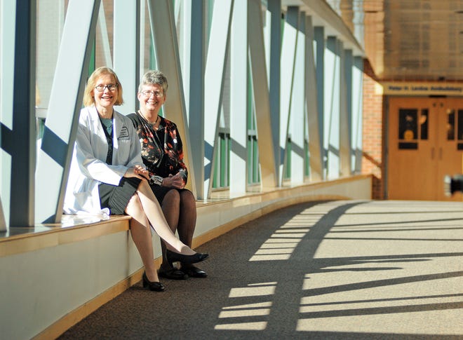 Dr. Susan Zweizig, a gynecologic oncologist, and Sheila Burque are pictured at the UMass Memorial Medical Center, Memorial Campus Oct. 8. Dr. Zweizig treated Burque's ovarian cancer in 2012 with surgery and an aggressive form of chemotherapy treatment. T&G STAFF/STEVE LANAVA