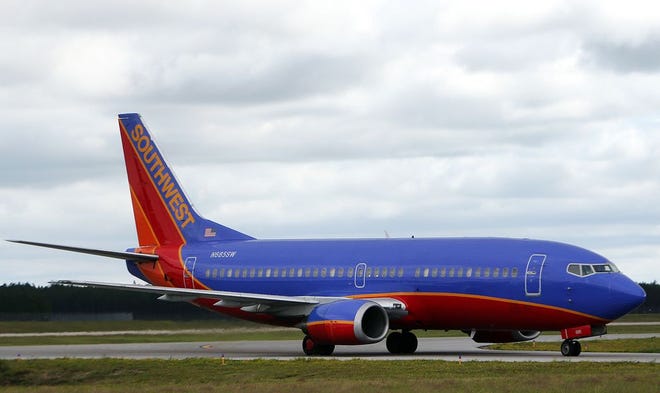 A Southwest Airlines jet lands at the Northwest Florida Beaches International Airport near West Bay earlier this month. Passenger traffic was up again in September 2015 over the previous year.