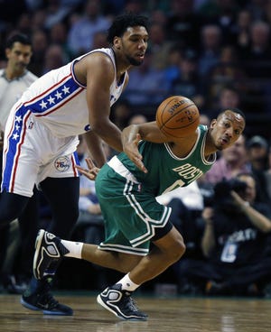 Sixers rookie center Jahlil Okafor (left) battles Celtics guard Avery Bradley for a loose ball Wednesday, Oct. 28, 2015.