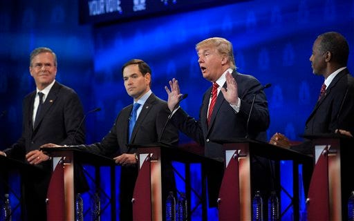 Donald Trump, second from right, speaks as Jeb Bush, left, Marco Rubio, second from left, and Ben Carson look on during the CNBC Republican presidential debate at the University of Colorado, Wednesday, Oct. 28, 2015, in Boulder, Colo. (AP Photo/Mark J. Terrill)