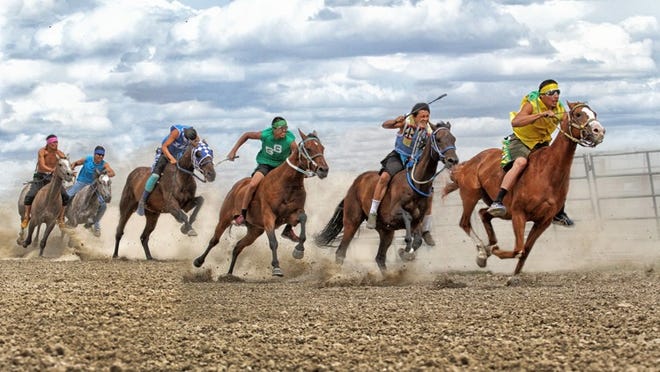 Native American riders participate in an Indian Relay Race. The sport is gaining popularity across the country. Seasonal Wellington residents Jeanette Sassoon and her husband Gary Fellers started the Professional Indian Horse Racing Association. Photo by Diana Volk