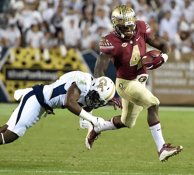 Florida State running back Dalvin Cook (4) runs against Georgia Tech defensive back Step Durham (8) during the first half of an NCAA college football game, Saturday, Oct. 24, 2015, in Atlanta.