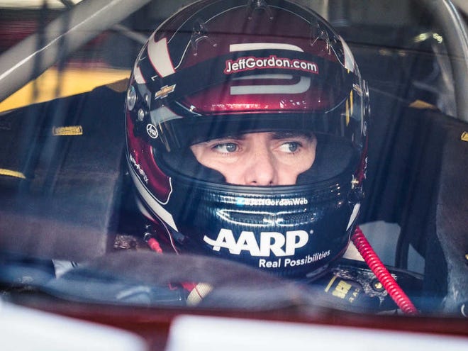 NASCAR Sprint Cup driver Jeff Gordon awaits the start of the first practice session for Sunday's NASCAR Sprint Cup auto race at Martinsville Speedway in Martinsville, Va., Friday, Oct. 30, 2015. (AP Photo/Steve Sheppard)