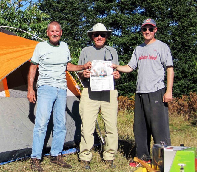 From left, Dave Roahrig of Coshocton, Jim Kent of Columbus and Tyler Roahrig of Coshocton make camp on the Fox River near Seney in the Upper Peninsula of Michigan, near where an Ernest Hemingway character camped. The anglers suggest taking hot dogs, just in case you don't catch trout.