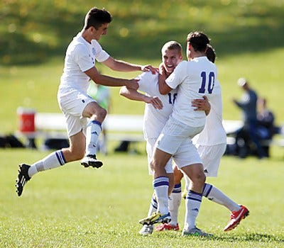 New Jersey Herald photo by Daniel Freel/Celebrate good times, come on! The SCCC men's team celebrates Thursday's goal that lifted them into the Region XIX championship game, which will be Sunday.