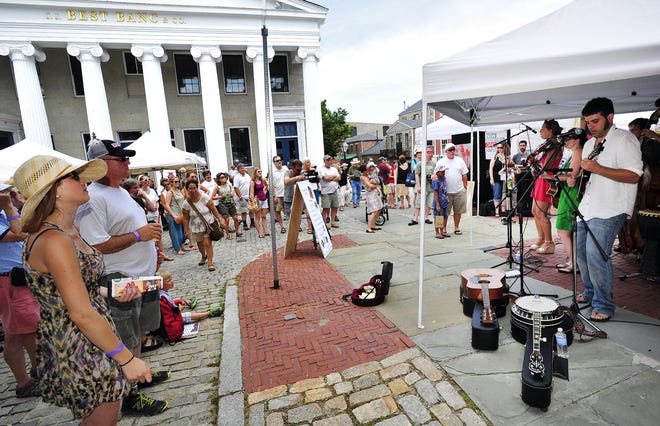 Grace Morrison and RSO gather a crowd along North Water Street during the 2013 New Bedford Folk Festival. David W. Oliveira/Standard-Times File