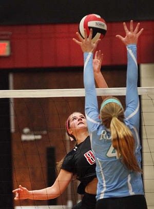 New Bern's Kjersti Solter (8) tries to hit the ball past J.H. Rose's Shelby Casey (4) during a volleyball match on Oct. 20. New Bern will play at J.H. Rose at noon on Saturday in the fourth round of the NCHSAA 4A playoffs.