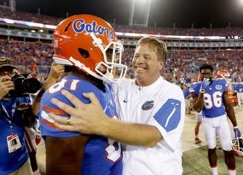 Florida Gators head coach Jim McElwain and wide receiver Antonio Callaway (81) celebrate on the sidelines late in the second half at Everbank Field on Saturday, Oct. 31, 2015 in Jacksonville, Fla. Florida defeated Georgia 27-3. Matt Stamey/Staff photographer