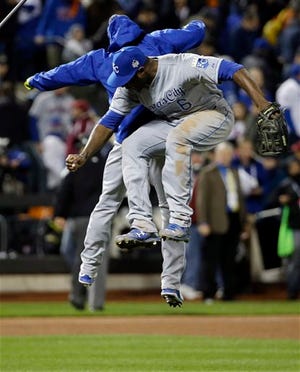 Kansas City Royals' Lorenzo Cain celebrates with a teammate after Game 4 of the Major League Baseball World Series against the New York Mets Saturday, Oct. 31, 2015, in New York. The Royals won 5-3 to take a 3-1 lead in the series. The Associated Press