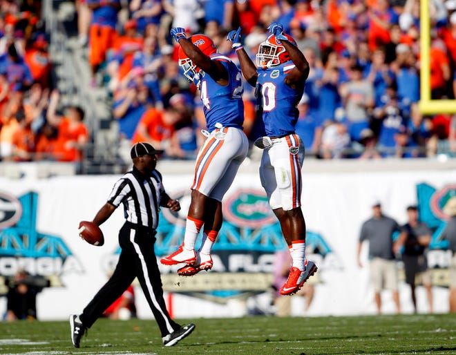 Florida Gators defensive back Brian Poole (24) and defensive back Marcus Maye (20) celebrate after a play against the Georgia Bulldogs during the first half at Everbank Field on Saturday, Oct. 31, 2015 in Jacksonville, Fla. Florida defeated Georgia 27-3. Matt Stamey/Staff photographer