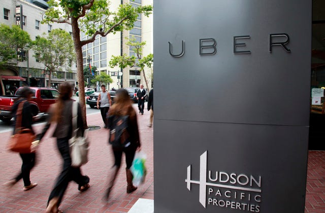 Foot traffic streams past Uber offices on Market Street in San Francisco. (Bay Area News Group)