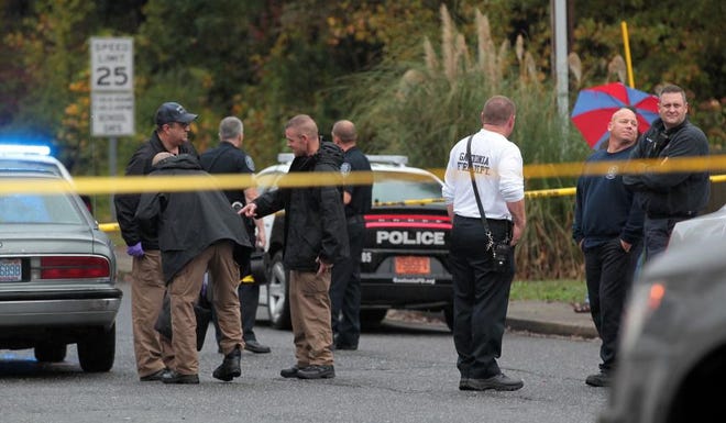 (Photo Mike Hensdill/The Gaston Gazette ) Police investigate the scene of a shooting at the intersection of Sedgefield Drive and South Myrtle School Road Monday afternoon, November 2, 2015.