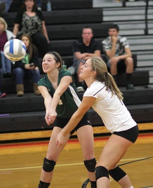 Emma Eberstein (left) and Kaley Smith of Mendon combine to pass off the ball to a teammate on Monday night.
