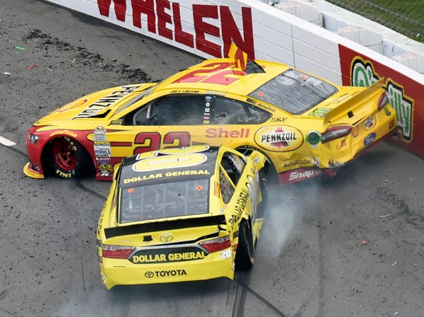Joey Logano, top, and Matt Kenseth get into a wreck during Sunday's NASCAR Sprint Cup Series race. (Don Petersen | Associated Press)