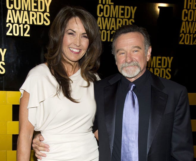 Robin Williams and his wife Susan Schneider arrive to The 2012 Comedy Awards in New York. The Associated Press