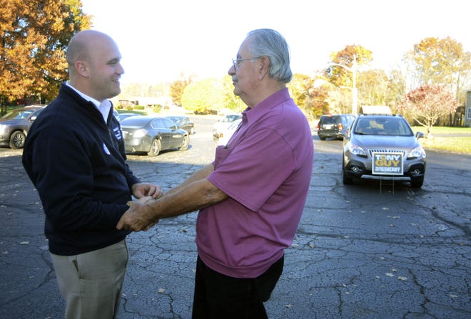 Daniel Camp, left, Republican candidate for county commissioner, talks with Greg Maslek outside of the polling place at Mount Carmel Presbyterian Church in Aliquippa on Election Day. Camp and Sandie Egley are the first Republican team to take control of the Beaver County board of commissioners in 60 years.