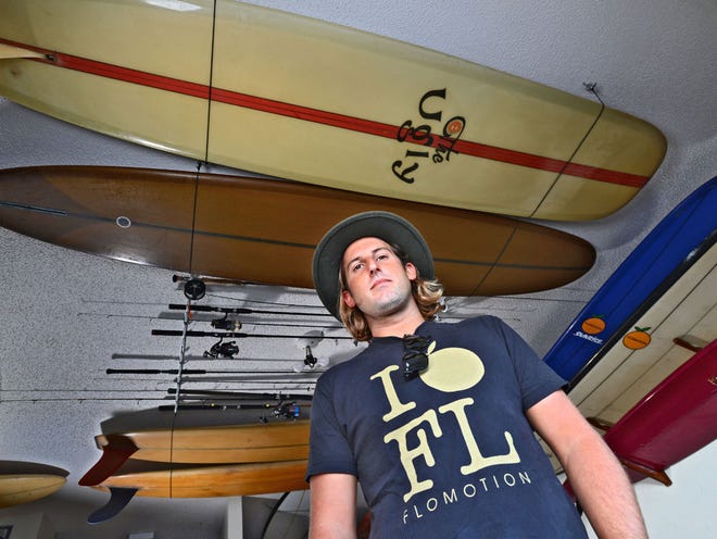 Justin Quintal of Jacksonville Beach, is one of the top longboard surfers in the world. He's built a career in the surf industry as well, using his fame to make a living for himself designing boards, fins, clothing and more. On Thursday October 29, 2015 Justin was photographed with a few of his vast collection of surfboards including a 10'0" longboard from his Black Rose label.