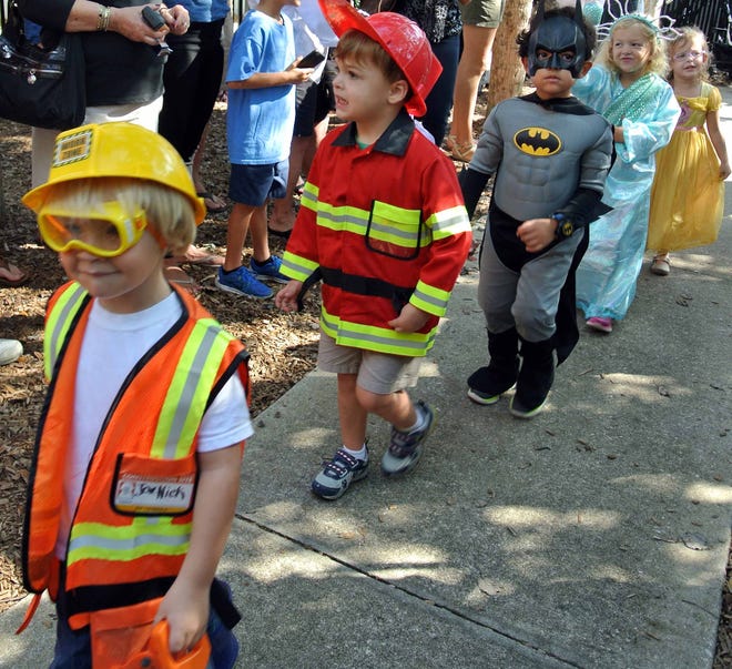 A construction worker, fireman, Batman, the Statue of Liberty and a princess marched in the Christ Episcopal Church pre-school Halloween parade.